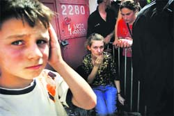 Displaced Georgians wait for humanitarian aid outside the civil registry of the Tblisi municipality on Friday