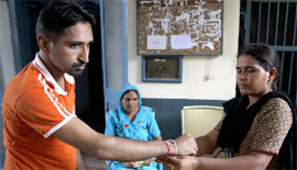 Mamta ties rakhi on the wrist of her brother undergoing jail term at the Central Jail in Bathinda on Saturday.