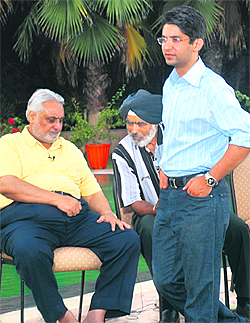 Olympic gold medal winner Abhinav Bindra strolling in his residence on the Zirakpur- Rajpura road on Saturday. Also seen in the picture are Abhinavs father, Dr A.S. Bindra, and his coach, Col Dhillon.