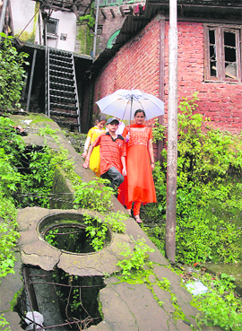 A view of an open manhole at Lower Bazaar in Shimla on Saturday.