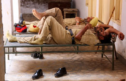 Taking time off from their hectic duties, policemen take a break in the sweltering heat in Bathinda.