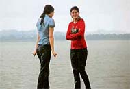 Two girls as also tourists caught in the rain at Sukhna Lake, Chandigarh