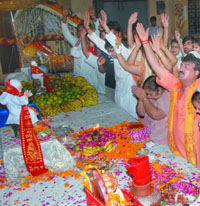 Sai devotees at the Sai Bhajan Sandhya organised by Shree Sai Ma Palaki Sewa Samiti at Adarsh Nagar in New Delhi on Sunday night.