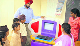 Students of Satya Bharti School at Fatehpur, near Ahmedgarh, evince interest in learning computers