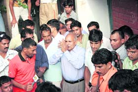 Akhil Kumars father wears a dejected look as he thanks the media, who had arrived at their home in Rohtak, after his son lost his quarterfinal bout at the Beijing Olympics
