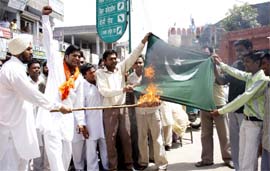 In retaliation to the desecration of the tricolour by the pro-Pakistan elements in Kashmir valley, VHP activists burning the Pakistani flag in Bathinda on Tuesday.