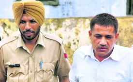 Accused in the Sarita suicide case Seelak Ram is produced in the CBI court in Ambala on Tuesday.