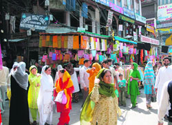 People throng markets in Srinagar on Tuesday upon the return of normalcy after 15 days of turmoil. 
