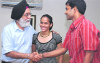 Saina Nehwal and her coach P. Gopichand during a meeting with sports minister M.S. Gill at his office in New Delhi on Tuesday. Tribune photo: Manas Ranjan Bhui 