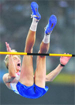 Russia's Andrey Silnov reacts after successfully completing a jump during the men's High Jump final at the National Stadium