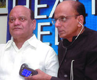 Dr K.K. Aggarwal, president, Heart Care Foundation of India, checks hasya kavi Surender Sharmas heartbeat at a press conference to promote the forthcoming MTNL Perfect Health Mela in New Delhi
