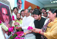 Union minister of telecommunication Jyotiraditya Scindia with DPCC president J.P. Aggarwal pays tribute to former Prime Minister Rajiv Gandhi on his birth anniversary at the DPCC office in New Delhi