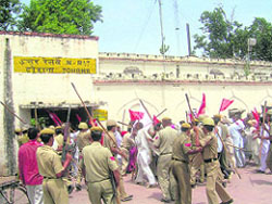 The police tries to disperse protesting Kisan Sabha workers at Tohana railway station in Fatehabad on Wednesday.