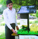 A participant displays his working model on Rajiv Gandhi Akshay Urja Divas, which was celebrated at Government Senior Secondary School, Kaddon, on Wednesday.