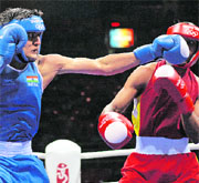Ecuador's Carlos Gongora (R) fights against India's Vijender Kumar during the middleweight (75 kg) quarterfinal boxing bout on Wednesday in Beijing. 
