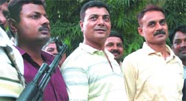 The Delhi police presents three men arrested for running tender racket in New Delhi on Thursday