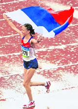 Olga Kaniskina of Russia celebrates winning the women's 20km walk of the athletics competition in the National Stadium at the Beijing 2008 Olympic Games on Thursday