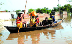 The people of Madaarpur village in Moga district ferrying their household items and children to a safer place