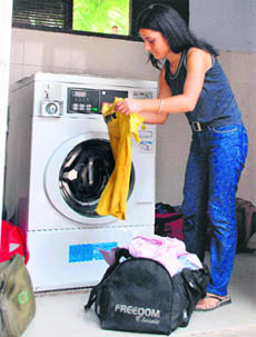A student of Panjab University washes laundry at the modern dhobi ghat in Sector 15, Chandigarh.