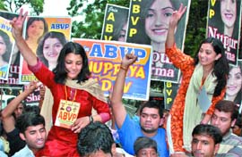 ABVP candidates come out after filing their nomination papers for the forthcoming Delhi University elections in New Delhi on Friday.