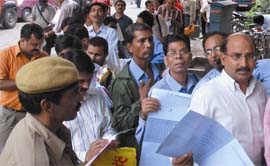 People queue up to submit forms of the Greater Noida Residential Scheme at Indian Bank, Connaught Place in New Delhi on Friday, which was the last date of submitting forms.