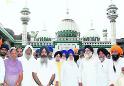 Leaders of Sikh organisations at Masjid Khairdin, Hall Bazar, Amritsar, on Friday. They were there to express solidarity with Muslim brethren
