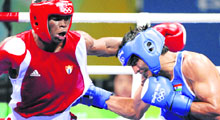 Cuba's Emilio Correa Bayeaux (L) fights against Vijender Kumar during their middleweight (75 kg) semifinal bout on Friday in Beijing.