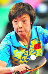 China's Zhang Yining hits a return against her compatriot Wang Nan in the women's singles table tennis final gold medal match at the Beijing Olympics on Friday. Zhang defeated her compatriot Wang 4-1 to win the gold medal.