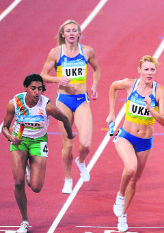 India and Ukraine compete during the women's 4400m relay round 1 heat 1 at the National Stadium during the Beijing Olympics on Friday.