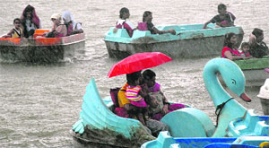 Holidaymakers are not put off by the surprise showers.