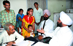 District and Sessions Judge Kuldip Singh advises a couple during Lok Adalat in Bathinda