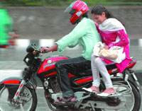 A couple caught in sudden rain in New Delhi on Saturday.