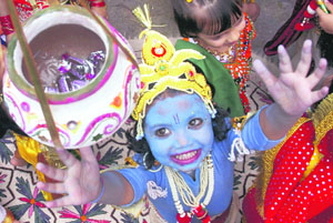 A child dressed as Lord Krishna participates in a fancy dress competition ahead of Janamashtmi celebrations in Shimla on Friday.