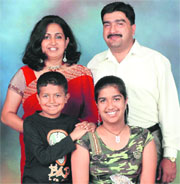 Col Jojan Joseph Thomas, who was martyred in an encounter with militants in Kupwara, Jammu and Kashmir, with his wife Beena Jojan Thomas and two children.