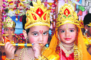 Playing god: Schoolchildren dressed as Radha and Krishna on the eve of Janmashtami in Bathinda