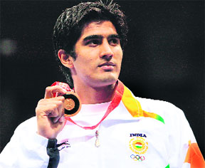 Vijender Kumar with his middleweight (75kg) bronze medal on Saturday.