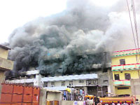 Firefighters arrive to douse the flames in a shoe factory in Bahadurgarh on Sunday.