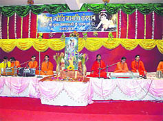 Disciples of Ashutosh Maharaj, founder of Divya Jyoti Sansthan, Noormahal, Jalandhar, recite bhajans in the municipal council hall at Nurpur on Saturday night. 