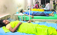 Stagnant water in a vacant plot in Gyaspura has become a breedng ground for mosequitoes; slush and filth dot the approach road to Ambedkar Nagar and (right) Patients undergoing treatment for gastroentritis at a hospital in Giaspura in Ludhiana.