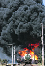 A burning fuel train in Gori, 80 km from Tbilisi, on Sunday. The train exploded on Georgias main east-west rail line 