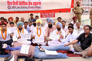 Members of the Bathinda Western Welfare Organisation staging a protest against the shifting of the post office from Paras Ram Nagar.