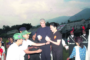 The GOC, Rising Star Corps, Lt-Gen Vijay Sharma, and president of the Army Wives Welfare Assciation Rupa Sharma release pigeons at the concluding ceremony of the 43rd raising day anniversary at Yol cantonment on Monday.