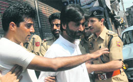 JKLF chairman Yaseen Malik being detained for defying curfew in Srinagar on Monday