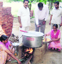 Midday meal being cooked for students out in the open in Mandi Ahmedgarh.