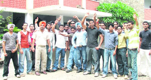 Students protesting on the premises of ITI campus in Ludhiana on Monday.