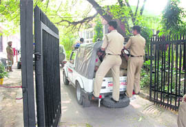 Sanjeev Bansal and Rajiv Gupta being taken inside the district courts to be produced before a local court in Chandigarh on Tuesday.