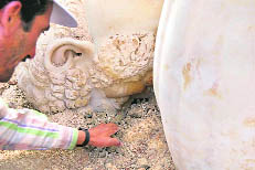 Picture shows an archaeologist working at the site of the discovery of the head of an exquisite marble statue of Marcus Aurelius who ruled between 161 and 180 AD, parts of which archaeologists in Turkey recently have discovered.