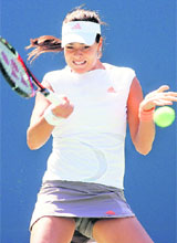 Ana Ivanovic of Serbia returns a shot against Vera Dushevina of Russia during Day 2 of the US Open on Tuesday.