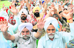 Members of Plot Allotment Sangharsh Committee, Sector 76-80, protest outside the PUDA office in Mohali on Wednesday. 