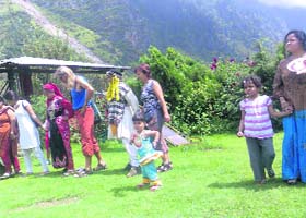 Tourists at an apple orchard near Manali